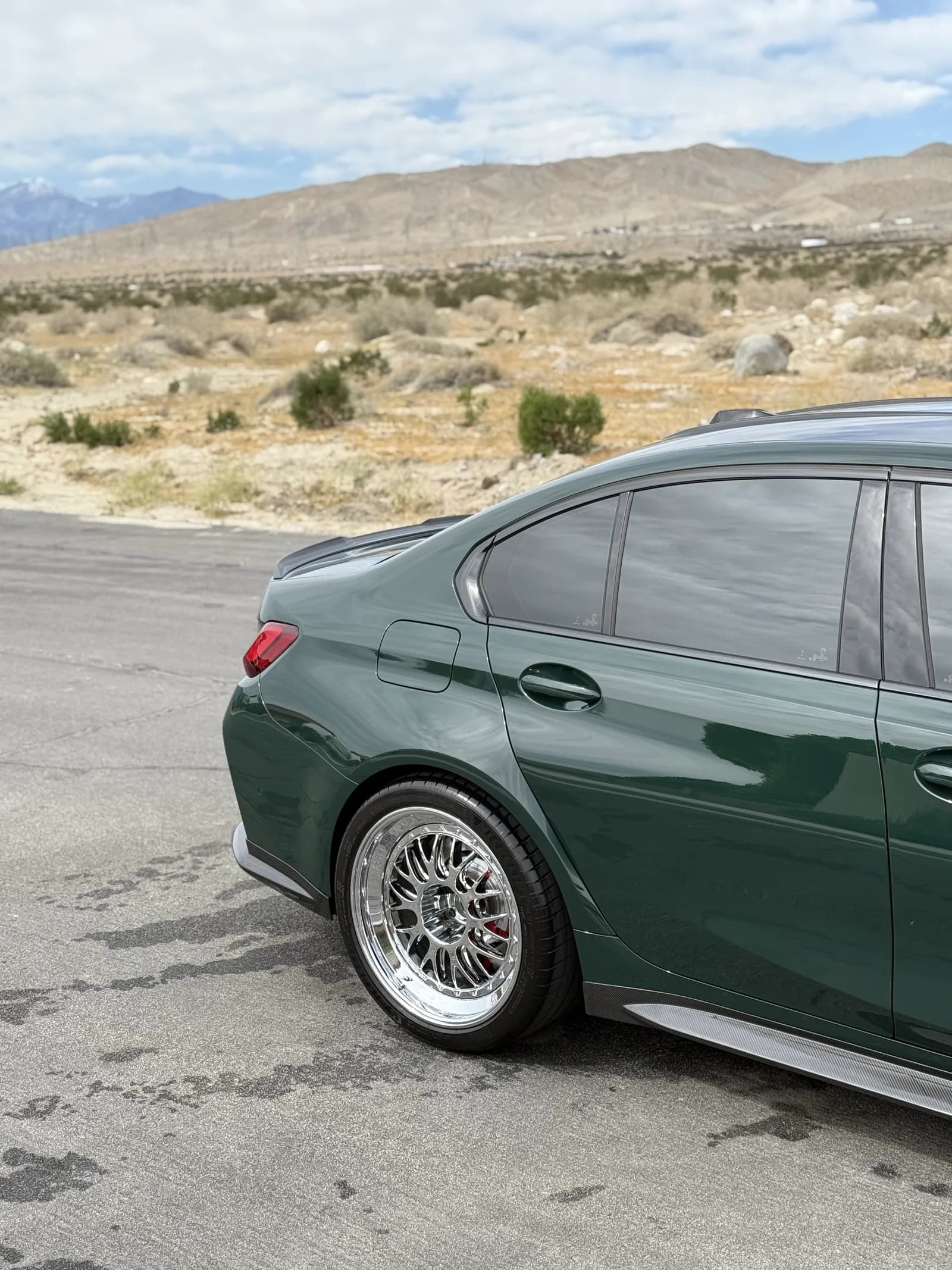 Rear-quarter finish on the same green BMW M3