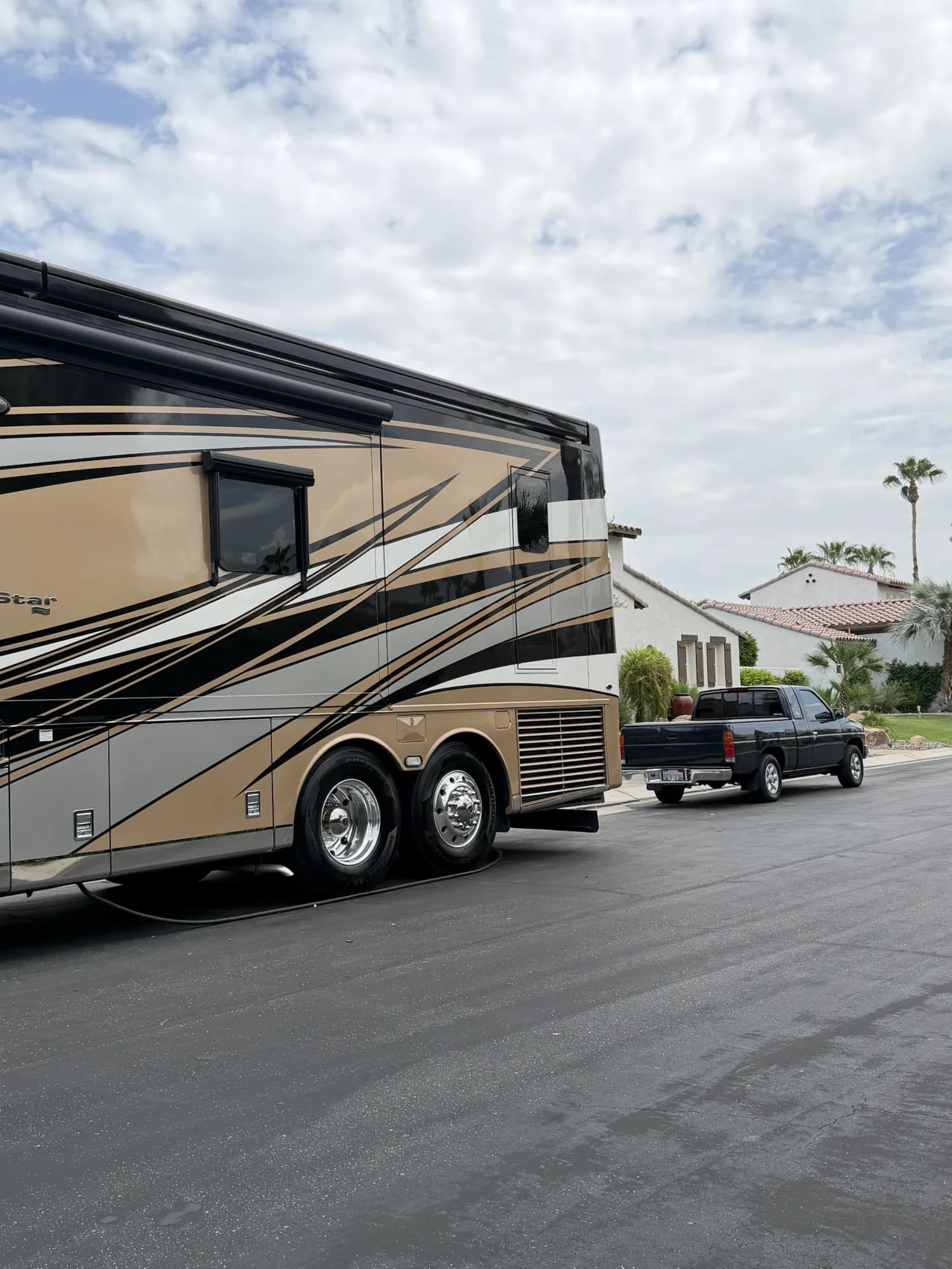 Polished side panels and wheels on a luxury motor coach